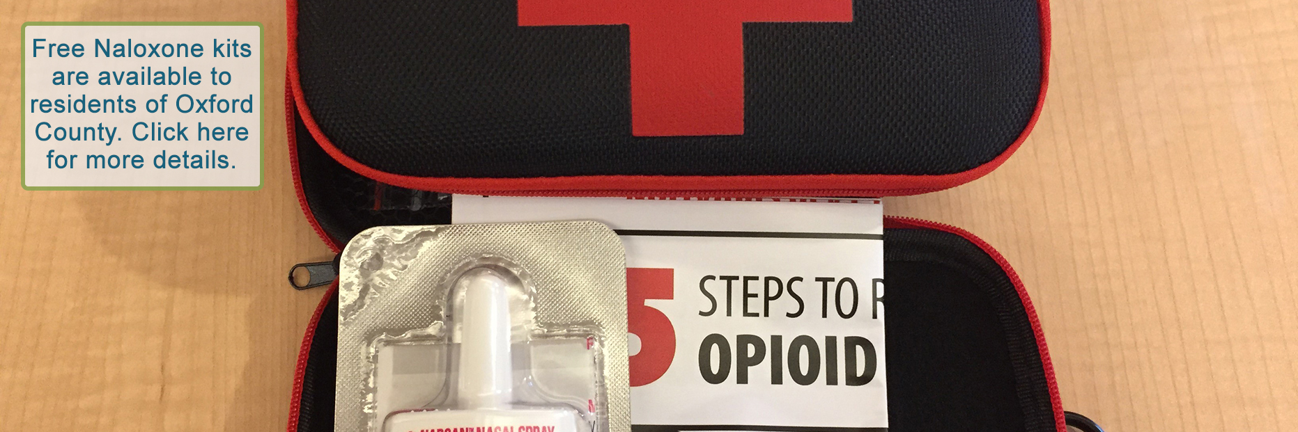 A close up photo showing a Naloxone kit. The kit shows "NARCAN NASAL SPRAY" and an instruction page.
